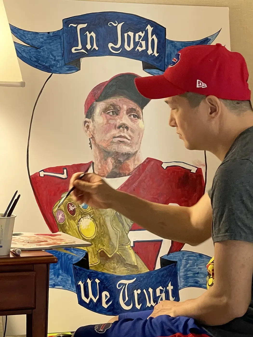Andrew Luy working on a painted relief portrait